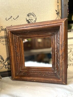 Vintage carved wood framed mirror